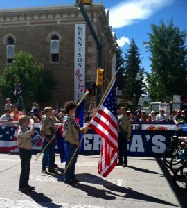 The Boy Scout Color Guard of Gunnison Salutes the National Anthem
