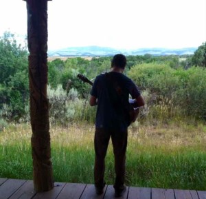 Steve Strumming the Guitar on Our Deck