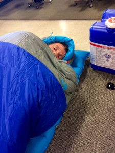 Steve Trying Out a Sleeping Bag at REI